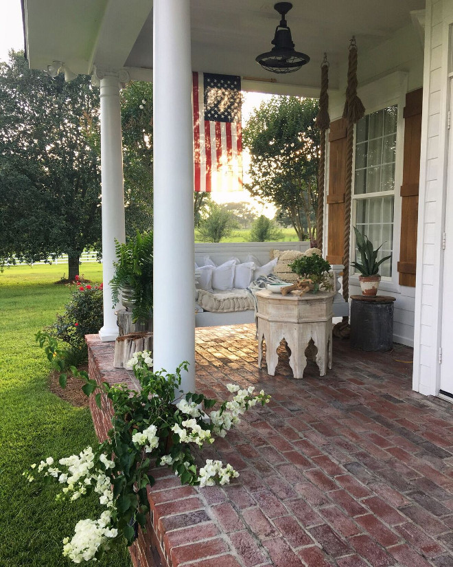 Porch Swing. Porch Swing with rope hangers. Rope Porch Swing. Porch with brick flooring and swing daybed with rope hangers. #porch #swing #swingdaybed #ropeswing #ropedaybed #porch #porchswing