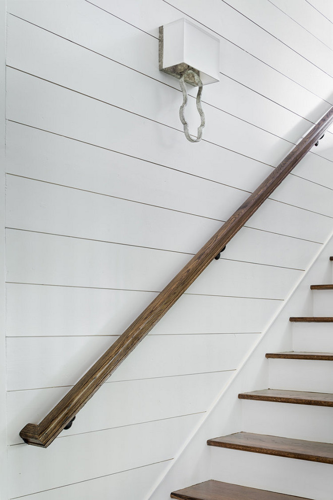 Shiplap Stair paneling with stained oak handrail. Staircase features shiplap paneling, stained oak handrail and oak stair treads. Shiplap Stair paneling ideas. Diy Shiplap Stair paneling. Shiplap Stair paneling with stained oak railing ideas. Shiplap Stair paneling with stained oak handrail. Shiplap Stair paneling with stained oak railing #ShiplapStairpaneling #stainedoakrailing #oakrailing #oakhandrail #handrail ##ShiplapStair #shiplappaneling #oakstairtreads #staitrtreads Willow Homes