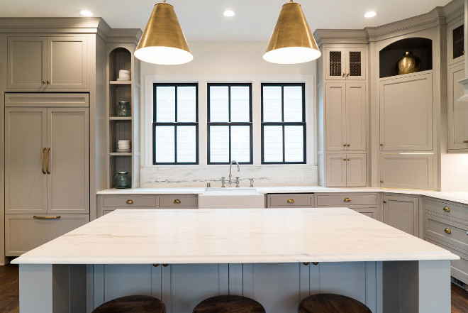 Soft Grey Kitchen Cabinet Paint Color Benjamin Moore Cape May Cobblestone Grey Cabinets are Maple with Inset doors and brass hardware. Countertop and backsplash is Danby Marble Honed. #SoftGreyKitchenCabinetPaintColor #SoftGreyKitchen #GreyCabinetPaintColor #BenjaminMooreCapeMayCobblestoneGrey Ramage Company