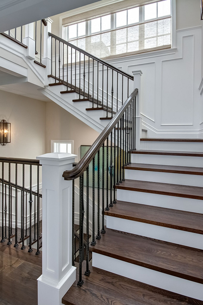 Staircase wood treads. wood treads. Staircase wood tread ideas. Staircase features wood treads and wrought iron spindles #Staircase #woodtreads #wroughtiron #spindles Brandon Architects, Inc.
