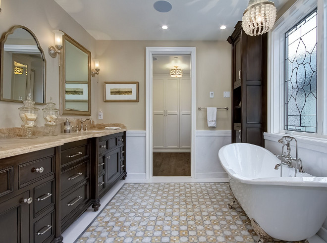 Traditional Bathroom Design. Traditional Bathroom Design Ideas. The master bathroom has a more traditional approach with dark stained cabinets, marble countertop and a clawfoot tub. Traditional Bathroom Design #TraditionalBathroom #TraditionalBathroomDesign Brandon Architects, Inc.