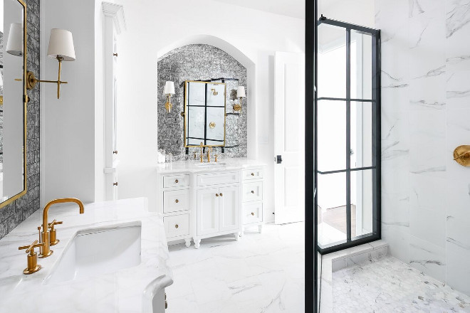 White Bathroom with Black Shower Frame. The master bathroom mixes different elements in a glamorous way. It features white marble, antique mirror subway tile backsplash, brass fixtures and black famed shower doors. White Bathroom with Black Shower Frame Ideas. White Bathroom with Black Shower Frame #WhiteBathroom #BlackShowerFrame #WhiteBathroomBlackShowerFrame #BlackShowerFrameIdeas Ramage Company