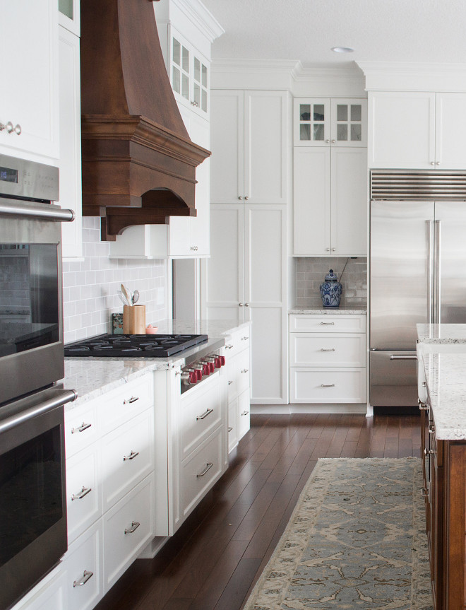 White Kitchen with Stained Wood Hood. White Kitchen with Stained Walnut Wood Hood Ideas. White Kitchen with Stained Wood Hood. White Kitchen with Stained Wood Hood #WhiteKitchen #StainedWoodHood #WoodHood #walnut #walnutkitchen Bria Hammel Interiors