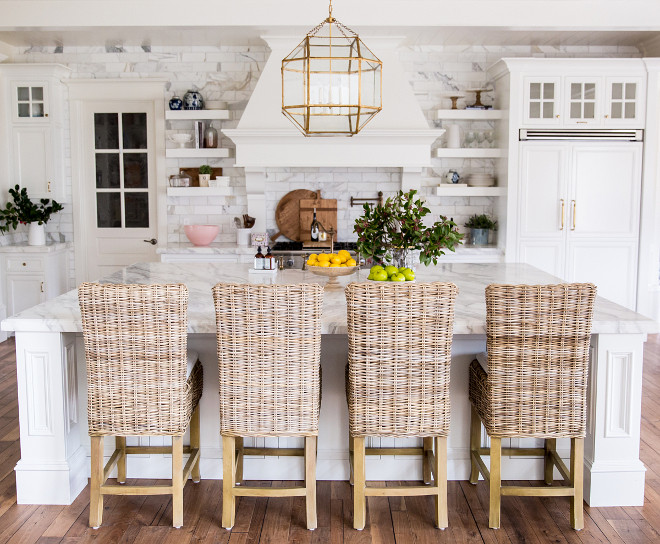 White Kitchen with farmhouse inspired decor. Rachel Parcell's kitchen - a modern classic white kitchen, featuring white cabinets, lots of brass, and marble - gets a glamorous version of a farmhouse style. White Kitchen with farmhouse inspired decor ideas. White Kitchen with farmhouse inspired decorating ideas #WhiteKitchen #farmhouseinspireddecor #WhiteKitchenfarmhousedecor #Kitchenfarmhousedecor #farmhousedecor Pink Peonies Rachel Parcell's Kitchen Pink Peonies Rachel Parcell's Kitchen