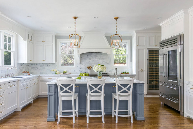 White Kitchen with Stacked Cabinets and Grey Island - Home Bunch