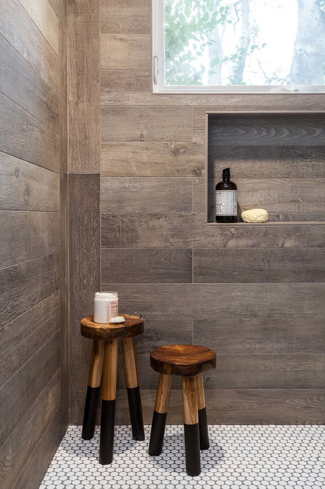 Wood-looking Tile. Wood-looking Shower Tile. According to the designer, the shower was designed to replicate the side of an old barn. Wall tiles are also Walker Zanger. Wood-looking Shower Tile Ideas. Wood-looking Shower Tile and penny floor tile. Wood-looking Shower # Woodlookingtile #ShowerTile #pennytile #WalkerZanger Juxtaposed Interiors