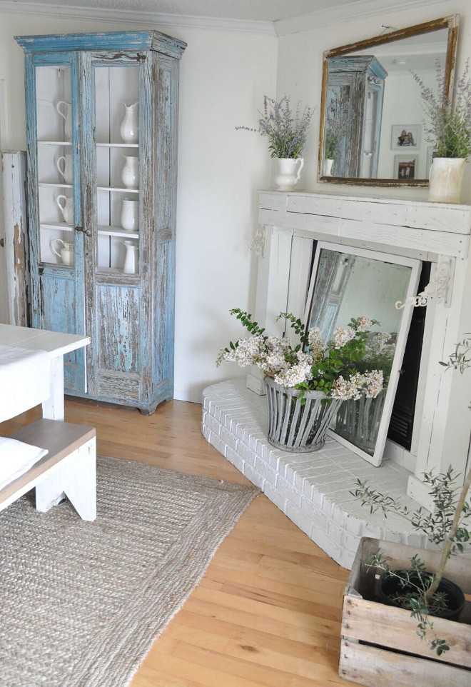 Farmhouse Fireplace. Farmhouse Fireplace. Farmhouse Fireplace. We designed and built the mantle from reclaimed wood. It's painted in Cotton Fluff by BEHR. Farmhouse Fireplace. Farmhouse Fireplace #FarmhouseFireplace Home Bunch's Beautiful Homes of Instagram @becky.cunningham.home
