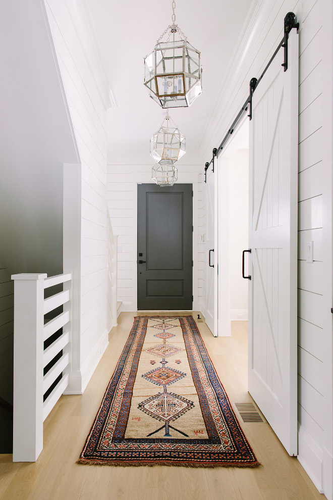 Farmhouse Hallway with bleached hardwood floors, shiplap paneling, vintage kilim runner, grey interior door and Visual Comfort Suzanne Kasler Morris Lantern Light Fixtures. Farmhouse Hallway with bleached hardwood floors, shiplap paneling, grey interior door and Visual Comfort Suzanne Kasler Morris Lantern Light Fixtures. Farmhouse Hallway with bleached hardwood floors, shiplap paneling, grey interior door and Visual Comfort Suzanne Kasler Morris Lantern Light Fixtures #Farmhouse #Hallway #bleachedhardwood #bleachedhardwoodfloors #shiplap #paneling #greyinteriordoor #greydoor #VisualComfort #SuzanneKasler #Morris #Lantern #LightFixtures #vintagekilimrunner #vintagerunner #kilimrunner Kate Marker Interiors