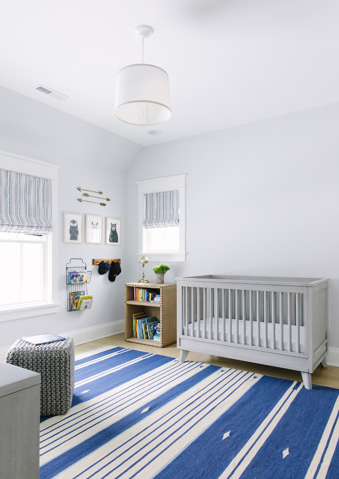 Grey nursery with striped rug. Nursery with striped rug. Pale grey nursery features a striped blue and white rug. Nursery with striped rug #Nursery #stripedrug Kate Marker Interiors