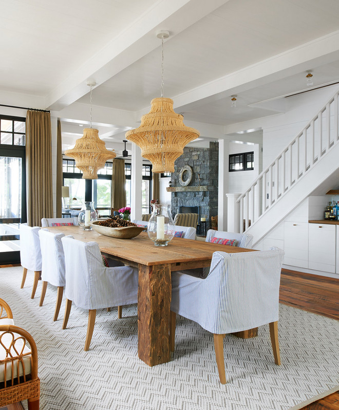 Jute twine chandelier. Coastal farmhouse dining room with Jute twine chandeliers. Coastal farmhouse dining room with two chandeliers and slipcovered dining chairs chairs. Jute twine chandelier. Jute twine chandelier #Jutetwinechandelier #Jutetwine #chandelier Jennifer Worts Design Inc