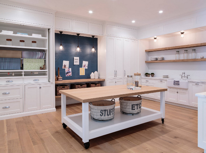 Large laundry room craft room design. This has to be one of the best large laundry room/craftroom designs I have ever seen! I would love to have this much space! The island on wheels was custom designed. Large laundry room craft room design ideas. Large laundry room craft room. Large laundry room craft room #Largelaundryroom #craftroom #laundryroomdesign #Craftroomdesign Haefele Design