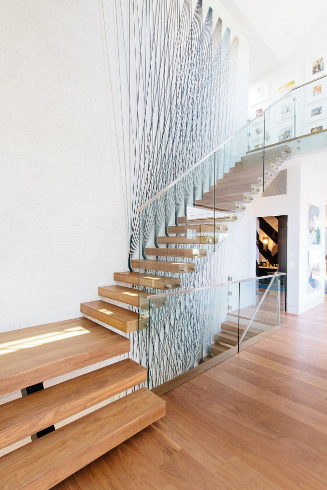 Modern Staircase with Glass rail on stainless steel stands offs with stainless steel cap. Modern Staircase with Glass rail on stainless steel stands offs with stainless steel cap #ModernStaircase #Glassrail #stainlesssteel