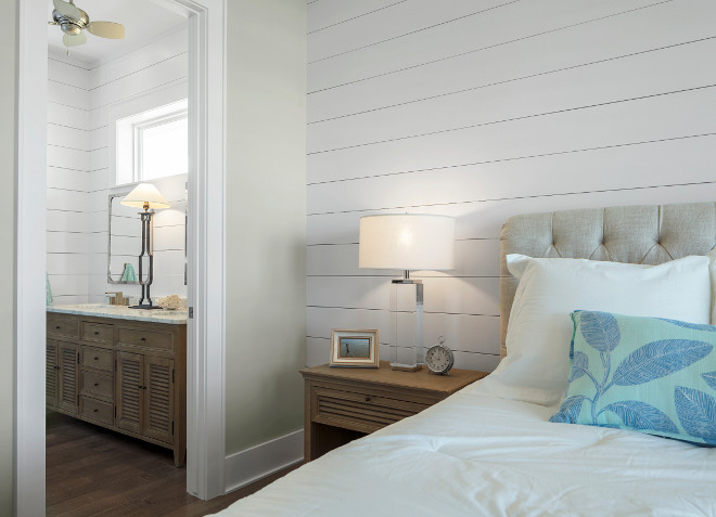 Neutral Coastal Farmhouse Bedroom and ensuite. The guest bedroom features shiplap and sheetrock walls. The sheettrock wall paint color is Sherwin Williams Agreeable Gray SW 7029. Neutral Coastal Farmhouse Bedroom and ensuite. Neutral Coastal Farmhouse Bedroom and ensuite. Neutral Coastal Farmhouse Bedroom and ensuite #NeutralCoastalFarmhouseBedroom Julie Barrett Design