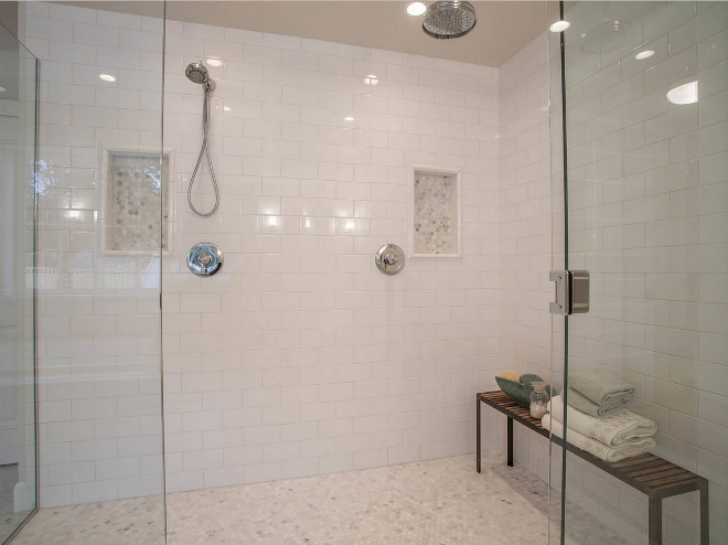 Shower subway wall tile and hex marble floor tile. Shower features subway tile on walls and 1" Hex Arabescato Carrara tile on floors and shower niche. Arabescato Carrara Honed 1" Hex. Shower features white subway tile on walls and 1" Hex Arabescato Carrara tile on floors and shower niche. #Shower #subwaywalltile #hex #marble #floortile Calista Interiors