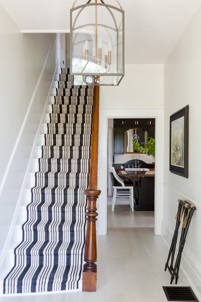 Striped stair runner. Stair runner is Dash & Albert. Striped stair runner. Stair runner is Dash & Albert. Farmhouse Striped stair runner. In the foyer a fun striped Dash and Albert runner was added to the staircase. The pattern is called Birmingham Black. Stair runner is Dash & Albert #Stripedstairrunner #Stairrunner #DashandAlbert Home Bunch's Beautiful Homes of Instagram Cynthia Weber Design @Cynthia_Weber_Design Photo by Robin Stubbert