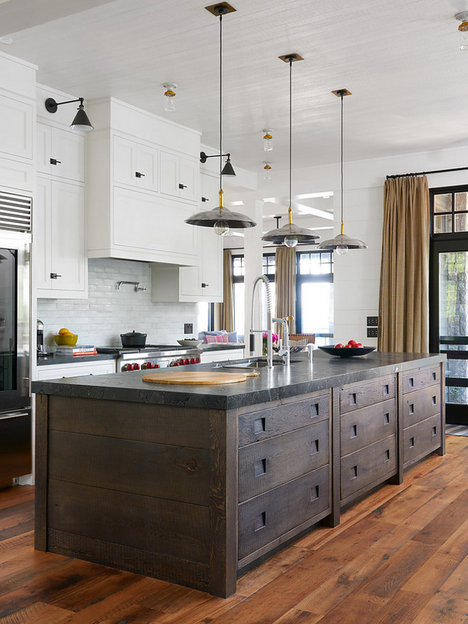 Wide shiplap kitchen island. Dark stained wide shiplap island. This farmhouse features stacked shaker cabinets, a dome kitchen hood and wide plank hardwood floors. It also features a dark brown salvaged wood kitchen island with stacked drawers and wide shiplap on the sides. The thick countertop is honed Belgian Bluestone. Farmhouse kitchen with dark shiplap island. Reclaimed wood shiplap. Wide shiplap kitchen island. Dark stained wide shiplap island. Farmhouse kitchen with dark shiplap island. Reclaimed wood shiplap #Wideshiplap #shiplapkitchenisland #kitchenisland #shiplapisland #farmhousekitchen #Darkstainedshiplapisland #Farmhousekitchens #darkshiplap #darkshiplapisland #Reclaimedwoodshiplap Jennifer Worts Design Inc