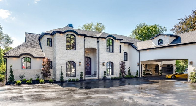 Modern French Chateau Style Custom Home Design. I could never get tired of the architectural details of this home. I love the stone exterior and the porte-cochère. Modern French Chateau Style Custom Home Design #ModernFrenchChateau #FrenchStyleHome #CustomHome #HomeDesign