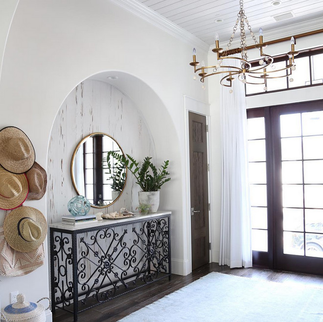 Arched Nook. Foyer with arched nook featuring pecky cypress wood. Arched Nook Foyer #ArchedNook #peckycypress #peckycypresswood