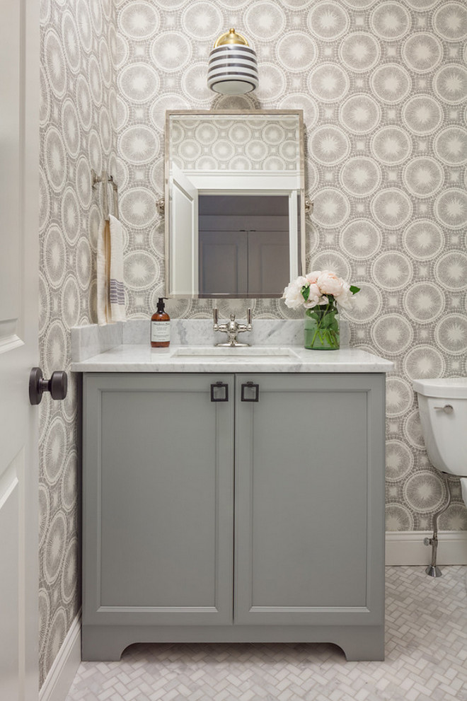 Bathroom Cabinet. Grey bathroom cabinet. Grey bathroom with white and grey wallpaper and herringbone marble floor tile. #BathroomCabinet #Greybathroom #bathroomcabinet #Greybathroom #whiteandgreywallpaper #herringbonemarblefloortile #herringbonefloortile #marblefloortile Jamie Keskin Design