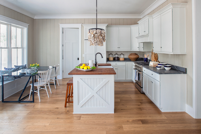 Farmhouse Kitchen. Simple farmhouse kitchen with crisp white cabinets painted in Sherwin Williams Pure White and vertical shiplap walls painted in Sherwin Williams Only Natural #farmhouse #kitchen #farmhousekitchen Lisa Furey - Barefoot Interiors