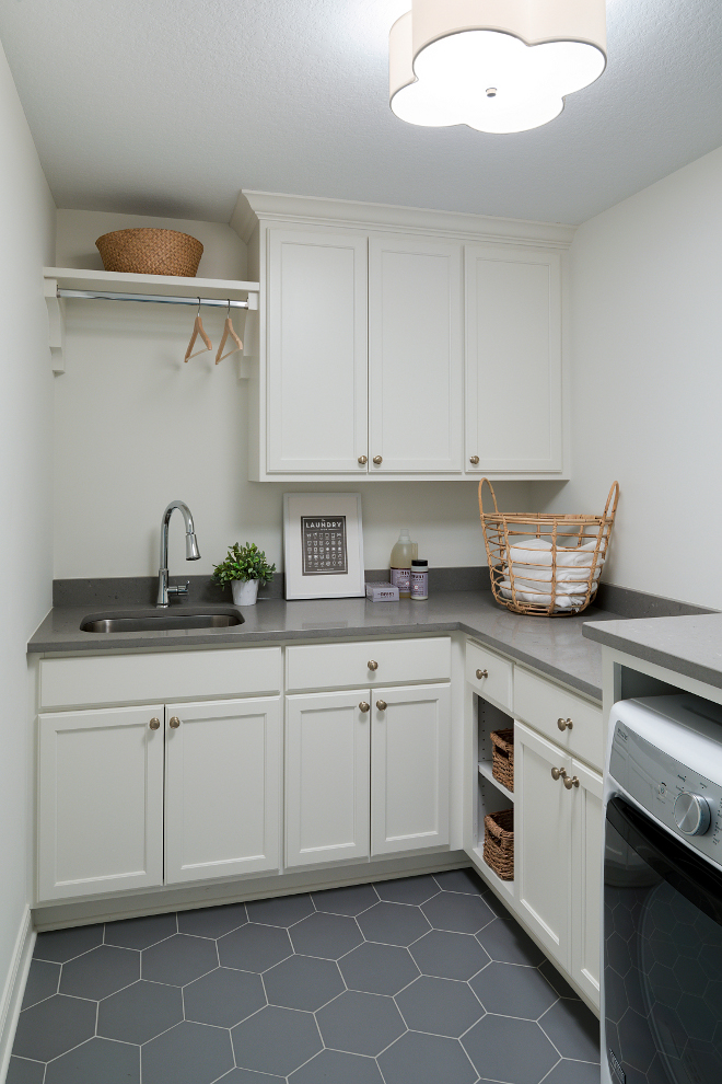 Laundry room with grey quartz countertop and grey hex floor tile. Flooring: Tile Shop Silver Hex. Countertop: Q Premium Quartz Fossil Grey. Laundry room with grey quartz countertop and grey hex floor tile ideas. Laundry room with grey quartz countertop and grey hex floor tile #Laundryroom #greyquartz #quartzcountertop #hexfloortile Bria Hammel Interiors