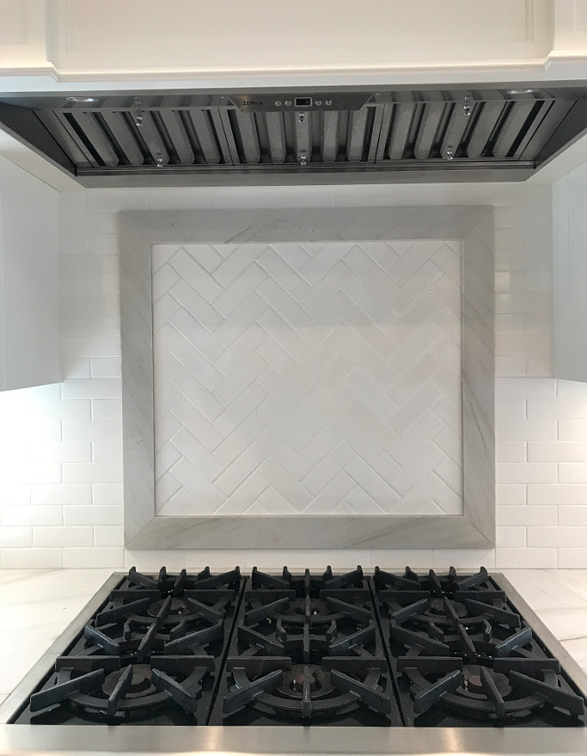 Quartzite Framed Herringbone Accent Tile above range. Kitchen features Quartzite Framed Herringbone Accent Tile above range. We used the same backsplash tile in a herringbone pattern above the cooktop and framed it with the same countertop material; Mont Blanc quartzite. Quartzite Framed Herringbone Accent Tile above range #Quartzite #Framedquartzite #Herringbone #AccentTileaboverange #Tileaboverange Home Bunch Interior Design