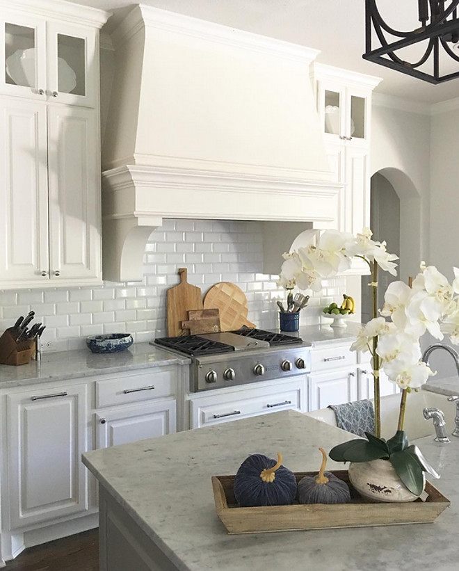 Velvet pumpkins. Kitchen island with reclaimed wood tray, white orchid and velvet pumpkins #velvetpumpkins @classicstylehome