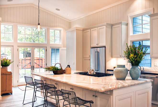 White Farmhouse Kitchen with Vertical Shiplap. Beautiful kitchen with vaulted high ceilings and French doors with transoms to patio. White Farmhouse Kitchen with Vertical Shiplap. White Farmhouse Kitchen with Vertical Shiplap. White Farmhouse Kitchen with Vertical Shiplap #WhiteFarmhouseKitchen #VerticalShiplap