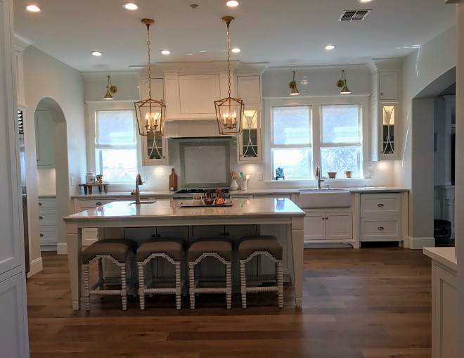 White kitchen with brass lighting. Classisc White kitchen with brass lighting. White kitchen with brass lighting #Whitekitchen #brasslighting Home Bunch Interior Design