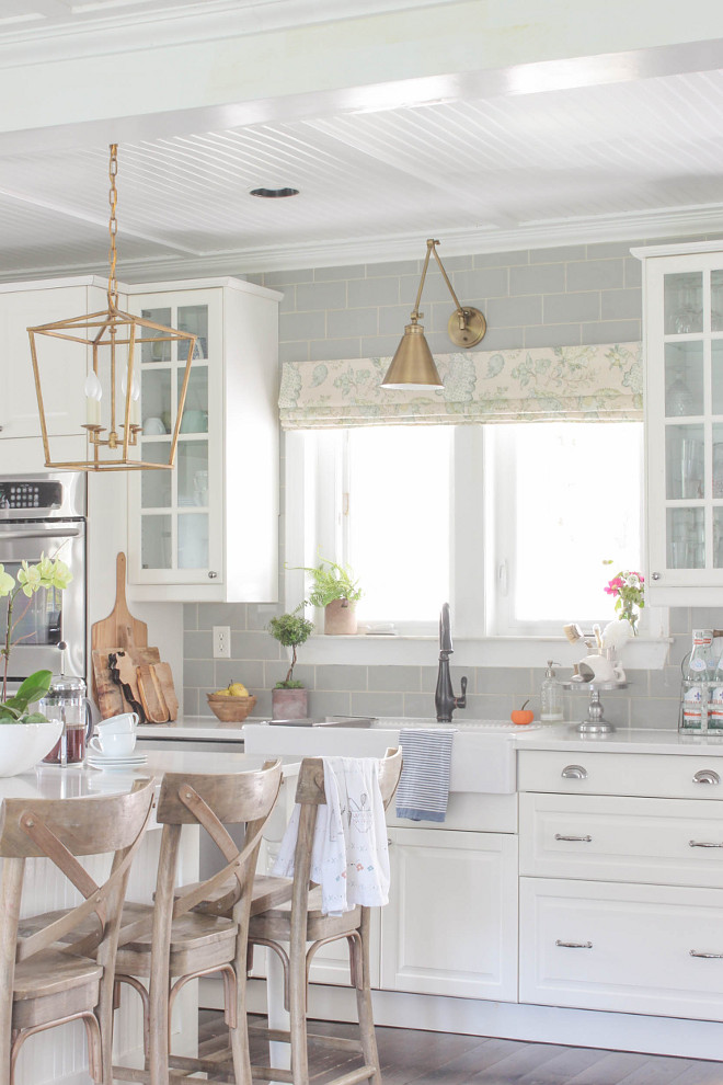 White kitchen with grey subway tile backsplash and brass lighting. White kitchen with grey subway tile backsplash and brass lighting. White kitchen with grey subway tile backsplash and brass lighting. White kitchen with grey subway tile backsplash and brass lighting. White kitchen with grey subway tile backsplash and brass lighting #Whitekitchen #greysubwaytile #backsplash #brasslighting @laura_willowstreetinteriors