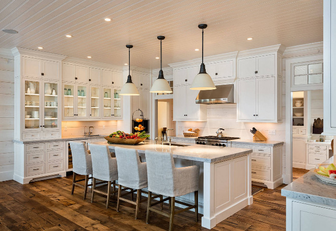 White kitchen with shaker style cabinets, beadboard ceiling, glass cabinets, wide plank floors, painted wood shiplap walls and shiplap backsplash. White kitchen with shaker style cabinets, beadboard ceiling, glass cabinets, wide plank floors, painted wood shiplap walls and shiplap backsplash #Whitekitchen #shakerstylecabinets #beadboardceiling #glasscabinets #wideplankfloors #paintedwoodshiplap #paintedshiplap #whitewashedshiplap #shiplapbacksplash Mitch Wise Design,Inc.