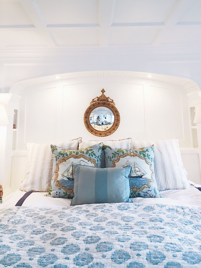 Blue and white bedding. Classic white bedroom with alcove and blue and white bedding. Bed is flanked by bookcases with an arched top and coffered ceiling. Linen bedding is Quatrine, clipper ship pillows are Schumacher, striped pillow is Quatrine. Blanket is from Nantucket. #bedroom #blueandwhitebedding #bedding #bedroomalcove #alcove Beautiful Homes of Instagram @SweetShadyLane