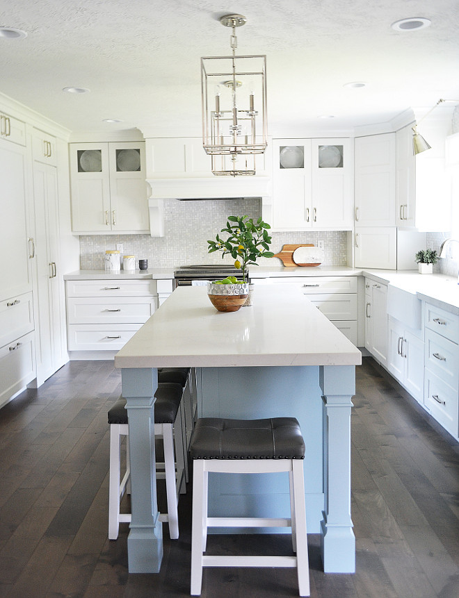 Blue kitchen island. Light blue kitchen island. A blue kitchen island brings some color to this white kitchen. Blue kitchen island #bluekitchenisland Sita Montgomery Interiors