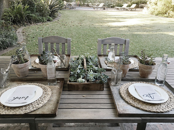Farmhouse outdoor dining with teak table teak chairs and succulents. We dine under the chandelier hanging from the tree all of the time. It’s the perfect setting to entertain guests. #farmhouse #outdoordining #teaktable #teakchairs #succulents Beautiful Homes of Instagram @my100yearoldhome
