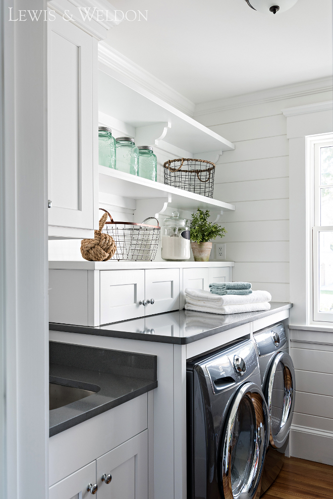 Laundry room with sink cabinet layout. This is not a big laundry room but the cabinet layout with sink offers a lot of storage and folding space. #Laundryroom #sink #cabinet #layout Lewis & Weldon Custom Kitchens