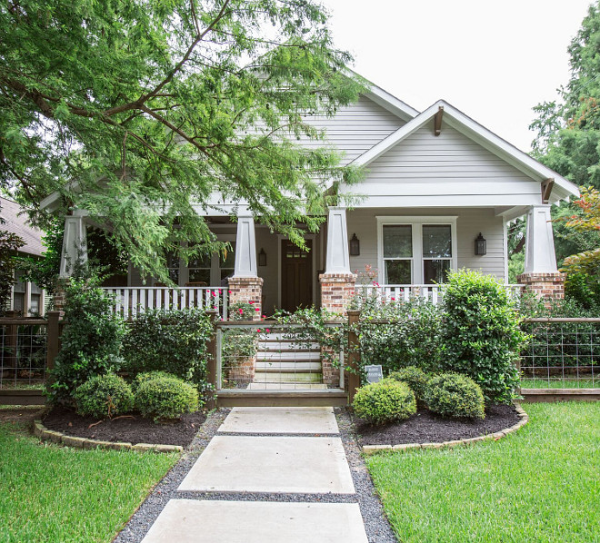 Restored 1920s American Craftsman style bungalow located in the Historic Heights District of Houston, Texas. The exterior of the home features custom shaker siding and custom millwork and trim - architectural details that are common in American Craftsman style homes. Marie Flanigan Interiors