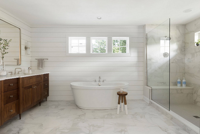 Shiplap bathroom. Clean lined bathroom with shiplap paneling and white marble flooring and shower tile. Refined LLC
