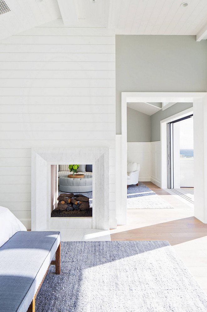 A Two-sided fireplace separates the master bedroom to the sitting area