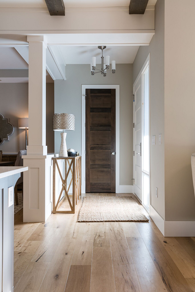 Benjamin Moore HC 172 Revere Pewter with with wide plank European Oak flooring The foyer opens to a bright home with wide plank European Oak flooring Paint color is Benjamin Moore HC 172 Revere Pewter