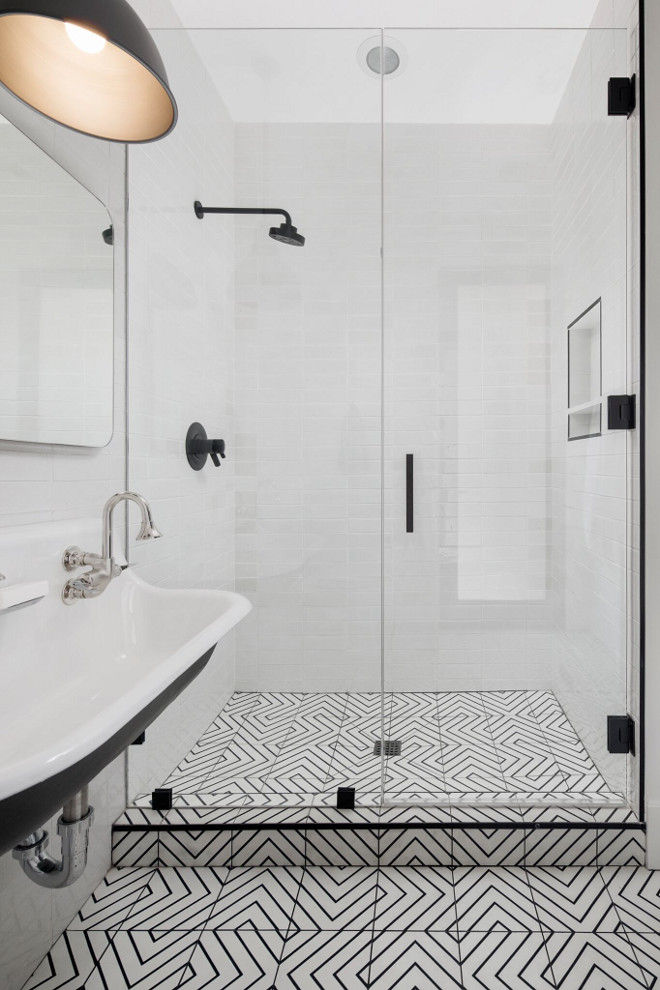 Black and white bathroom tile. Bathroom floor tile is Zenith Moroccan Encaustic Cement Tile from Cle Tile. Notice the Black Schluter trim around the shower. Black and white tile. Modern farmhouse bathroom with black and white cement tile. #blackandwhite #bathroom #floortile #blackandwhitecementtile A Finer Touch Construction