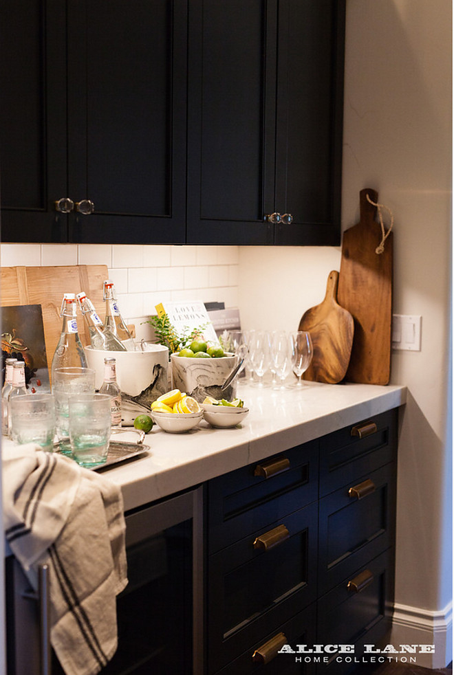 Butlers pantry with black cabinets and brass hardware. Alice Lane Home Collection