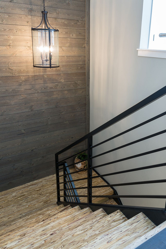 Modern Farmhouse staircase with metal railing and Parallam stair treads "Parallam" is n engineered laminate lumber, often used as structural beams and posts