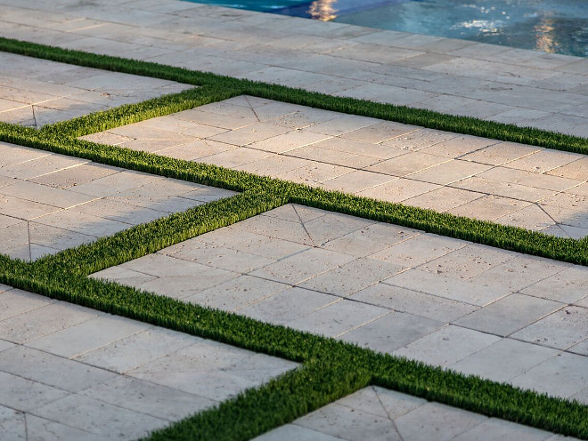 Patio with limestone block and grass. A Finer Touch Construction