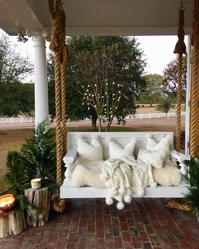 Rope Swing Porch with rope swing with white faux fur cushion, throw pillows and Anthropologie throw #ropewswing #porch #porchswing #anthropologie #pillows #throw @cindimc.ivoryhome