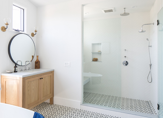 Shower Tile Shower floor tile is cement tile and walls are herringbone white tile The shower wall tile is a white tile set in a herringbone pattern Matte white 3x6 and 2.5 x 9 in straight joint, herringbone, and chevron patterns by Sonoma Tile