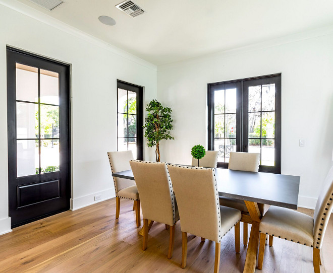 Dining room with black Doors and Windows Solar Tite / White exterior / painted black interior
