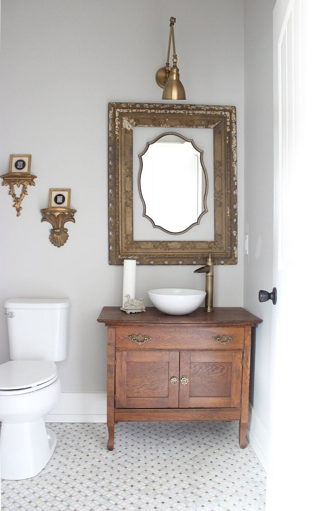 The half bath is also near and dear to my heart. My grandmother's washstand was repurposed to become the sink vanity and other vintage pieces hang simply throughout. I went with brushed gold in here to tie in the flower floral marble mosaic flooring which was a splurge, but my absolute favorite tile Beautiful Homes of Instagram Home Bunch @crateandcottage
