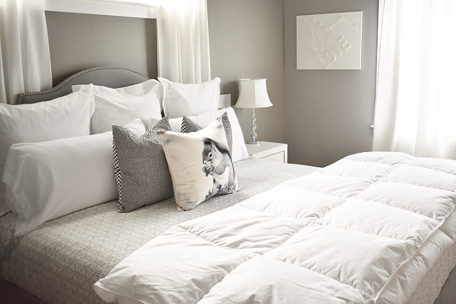 Grey Bedroom with grey and white bedding and grey headboard - Home Bunch's Beautiful Homes of Instagram