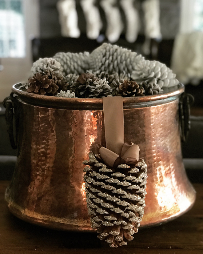 I am loving the simplicity of a copper pot filled with pine cones as a starting point for our holiday decor