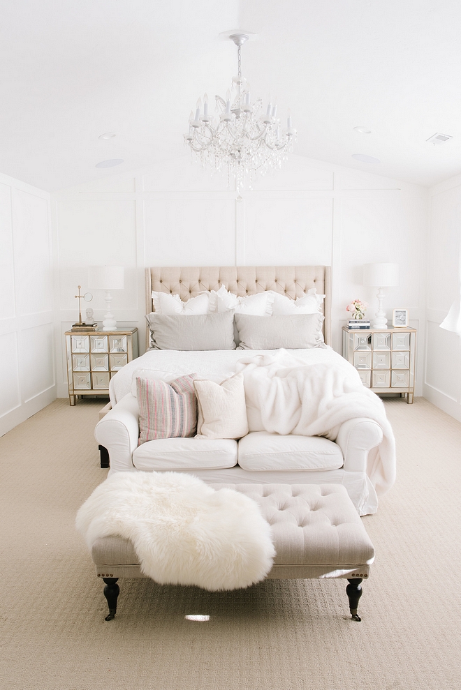 White Master Bedroom with linen bed linen bench glass chandelier grid board paneling and mirrored nightstands #whitemarterbedroom #whitebedroom